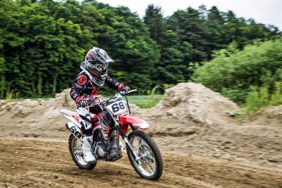 Teen motocross Switzerland: young rider with race number 68 on a Honda CRF on the MX-Academy motocross track Teen motocross Switzerland: young rider with race number 68 on a Honda CRF on the MX-Academy motocross track